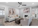 Bright living room features hardwood floors, a cozy fireplace, and neutral-toned decor at 985 Columbia Dr, Decatur, GA 30030