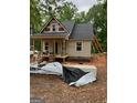 Exterior view of a home under construction showing siding, windows, porch framing and construction materials at 509 Tree Rdg, Carrollton, GA 30116
