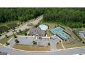 Aerial view of the community center, pool and tennis courts at 100 Maple Leaf Rd, Sharpsburg, GA 30277