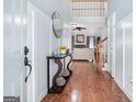 Welcoming foyer with hardwood floors, a stylish console table, and views into the living area at 1211 Fly Rod Ln, Loganville, GA 30052