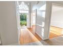 Elegant foyer with hardwood floors, beautiful arch window, and bright lighting at 161 Pleasant Grove Rd, Mcdonough, GA 30252