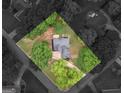 Aerial view showcasing the home's placement on a lot with mature trees and lush landscaping at 30 Stonewall Dr, Covington, GA 30016