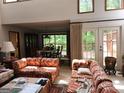 Bright living room with large windows, access to the deck, and comfortable seating at 363 Weatherstone Ln, Marietta, GA 30068