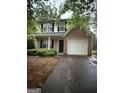 Charming two-story home with neutral siding, brick accents, and a two-car garage at 4752 Browns Mill Ferry, Lithonia, GA 30038