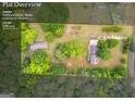 Expansive 1.88-acre lot with mature trees, a house, and outbuilding at 74 Price W Dr, Locust Grove, GA 30248