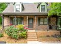 Inviting brick front porch with charming details and a cozy atmosphere at 74 Price W Dr, Locust Grove, GA 30248