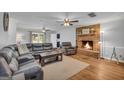 Spacious living room featuring a brick fireplace and comfortable seating at 74 Price W Dr, Locust Grove, GA 30248