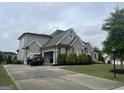 Beautiful two-story home with well-manicured landscaping and a three car garage at 312 Archway Ln, Peachtree City, GA 30269
