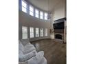 Spacious living room boasts tall ceilings, a fireplace, and large windows at 312 Archway Ln, Peachtree City, GA 30269