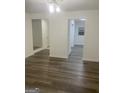 Spacious living area boasts sleek hardwood floors, neutral paint, and great natural light at 103 Tiburon Ct, Stonecrest, GA 30038