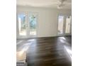 Bright living room with hardwood floors and double doors, perfect for indoor-outdoor living at 103 Tiburon Ct, Stonecrest, GA 30038