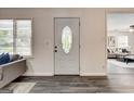 Classic front door design with oval window and views of the cozy living space at 203 Brannan Rd, Mcdonough, GA 30253