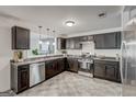 Well-lit kitchen with ample counter space, stainless steel appliances, and modern fixtures at 203 Brannan Rd, Mcdonough, GA 30253