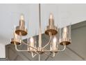 Close up of a modern chandelier with glass shades and a gold finish at 5314 Tolar Rd # 23, South Fulton, GA 30213