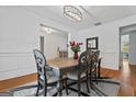 Charming dining room with hardwood floors, wainscotting, and a rustic dining table at 2265 Venture Dr, Marietta, GA 30062