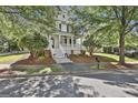 Beautiful two-story home featuring a spacious front porch and nicely landscaped front yard at 100 Concord Ct, Fayetteville, GA 30214