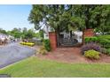 Addison at Cascade Center Homes entrance sign surrounded by lush greenery and gated access at 1823 Devon Sw Dr, Atlanta, GA 30311