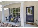 Inviting front porch with seating area, perfect for relaxing and enjoying the outdoors at 11255 Wittenridge Dr, Alpharetta, GA 30022