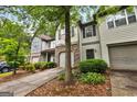 Well landscaped townhome with stone accents and an attached garage at 547 Se Tufton Se Trl, Atlanta, GA 30354