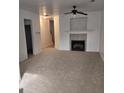 Cozy living room with fireplace, carpet flooring, neutral wall colors and views to hallway at 547 Se Tufton Se Trl, Atlanta, GA 30354