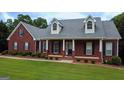 Well-maintained home with a charming front porch and manicured landscaping at 1118 Sequoia Trl, Mcdonough, GA 30252