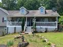 Charming house with a quaint front yard and a cozy covered porch at 1137 Eagles Nest Cir, Carrollton, GA 30116