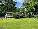 Charming home with a inviting front porch and well-manicured lawn at 1170 5Th Ave, Jonesboro, GA 30236