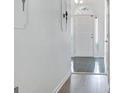 Bright hallway featuring tile flooring and leading to a naturally illuminated front entrance at 323 Newfield Way, Peachtree City, GA 30269