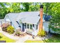 Inviting home with a brick chimney, flower box and well-manicured lawn at 527 W Church St, Villa Rica, GA 30180