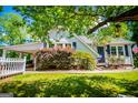 Charming home featuring a carport, and a lush front lawn at 527 W Church St, Villa Rica, GA 30180