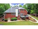 Expansive backyard featuring a deck and a well-manicured lawn at 119 Crown Springs Dr, Mcdonough, GA 30252