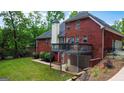 Backyard with a wooden deck and a lush green lawn, perfect for outdoor enjoyment at 119 Crown Springs Dr, Mcdonough, GA 30252