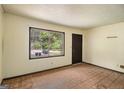 Simple bedroom with panelled walls and a view of the outdoors at 6109 Oakwood Sw Cir, Covington, GA 30014