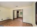 Spacious living room featuring tile floors and natural light at 6109 Oakwood Sw Cir, Covington, GA 30014