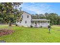 Beautiful two-story home featuring a spacious yard, inviting porch, and a classic, well-maintained exterior at 1125 Babbs Mill Rd, Hampton, GA 30228