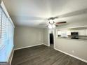 A well-lit living room featuring modern flooring and a view into the kitchen at 1889 Silver Creek Dr, Austell, GA 30168