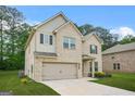 Beautiful new construction two-story home with a brick facade, attached garage, and well-manicured front lawn at 116 Cabin Way, Hampton, GA 30228