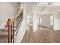Bright living room with neutral walls, modern fireplace, and stunning staircase at 116 Cabin Way, Hampton, GA 30228
