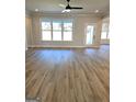 Sun-drenched living room boasting wood floors and a door to the outdoors at 1685 Crumbley Rd # 4, Mcdonough, GA 30252
