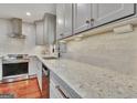 Kitchen showcasing white countertop, stainless steel appliances, and white cabinets at 104 Whisper Trce, Peachtree City, GA 30269