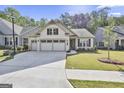 Attractive single-story home featuring a three-car garage and a well-maintained front yard at 430 Silverbell Ct, Peachtree City, GA 30269