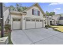 Spacious three-car garage with ample driveway space in front of the charming one-story home at 430 Silverbell Ct, Peachtree City, GA 30269