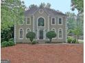 Charming two-story home showcasing a symmetrical facade and inviting entryway at 112 Windalier Rdg, Peachtree City, GA 30269