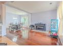 Bright living room with hardwood floors, a dining table, and elegant accents and decor at 2022 Maple Ridge, Acworth, GA 30101