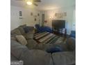 Comfortable living room with a large sectional sofa, creating a cozy gathering space at 288 Harper Se Rd, Atlanta, GA 30315