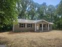 Inviting single-story home featuring a metal roof and covered porch at 367 Frashier Rd, Carrollton, GA 30116