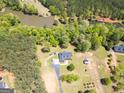 Expansive aerial view showcasing the home and property, including the nearby lake at 637 Lakeview Dr, Newborn, GA 30056