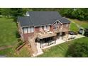 Beautiful brick home featuring a spacious deck and patio area, ideal for outdoor entertaining at 637 Lakeview Dr, Newborn, GA 30056