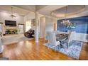 Open-concept dining room with hardwood floors, modern chandelier, and natural light at 4180 Mount Paran Dr, Social Circle, GA 30025