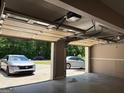 Attached two car garage with automatic door opener, offering ample parking with drive-through access at 2828 Hicks Sw Rd, Marietta, GA 30060